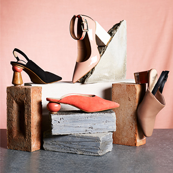 Ladies shoes with interesting heels on concrete bricks