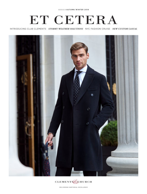 Man in an overcoat and suit outside of The Four Seasons Hotel, Towerhill London